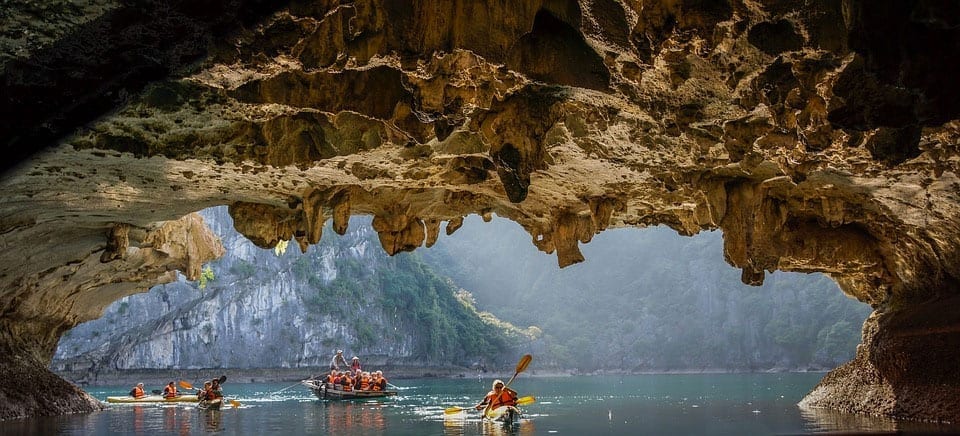 RNE Students kayak through Bat cave in Ha Long Bay